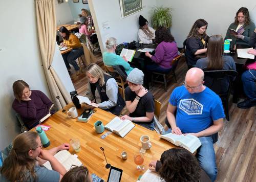 At a March 2024 meeting of the Silent Book Club&rsquo;s Minneapolis chapter, two dozen people gathered at Cream & Amber in Hopkins, Minn., to quietly read books of their own choosing. (Tribune News Service files)