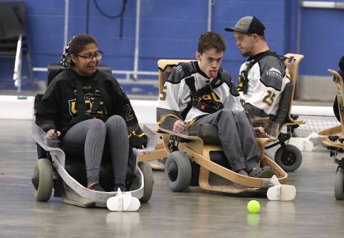 Anshika Chimpa, left, and Daniel Laurenco, right, look on as Jack Miskulin heads for the ball during a Westman Volt Hockey practice at the Brandon Curling Club on Sunday morning. Three teams are headed to a giant tournament in Calgary this weekend. (Perry Bergson/The Brandon Sun)