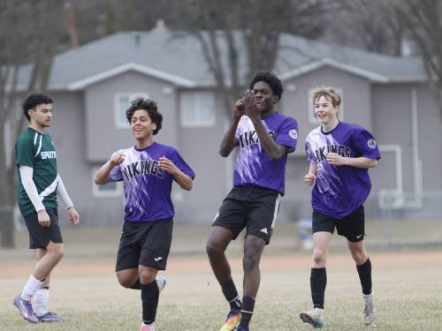Vincent Massey striker Timi Fadare celebrates with Eduardo Rodriguez Osegueda after capitalizing on his second penalty kick of the game during their Brandon High School Soccer League match at Neelin on Wednesday. (Massimo De Luca-Taronno/The Brandon Sun)