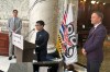 Deputy Chief Coun. Cyril Bennett-Nabess speaks during a ceremony, before the introduction of provincial legislation to advance the ratification of a treaty with the Kitselas First Nation, at the B.C. Legislature in Victoria, on Wednesday, April 15, 2026, as Premier David Eby, left, and Spencer Chandra Herbert, Minister of Indigenous Relations and Reconciliation, right, look on. THE CANADIAN PRESS/Wolfgang Depner