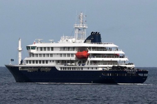The MV Hondius cruise ship departs the port in Praia, Cape Verde, Wednesday, May 6, 2026. (AP Photo/Misper Apawu)