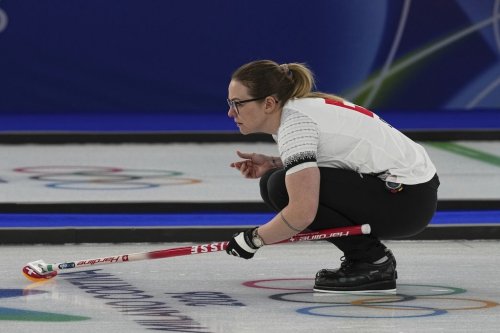 Switzerland's Alina Paetz in action during the women's curling round robin session against Sweden at the 2026 Winter Olympics, in Cortina d'Ampezzo, Italy, Monday, Feb. 16, 2026. (AP Photo/Fatima Shbair)