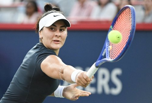Bianca Andreescu, of Canada, plays a shot to Barbora Krejcikova, of the Czech Republic, during their first round match at the National Bank Open tennis tournament in Montreal, Sunday, July 27, 2025. THE CANADIAN PRESS/Graham Hughes