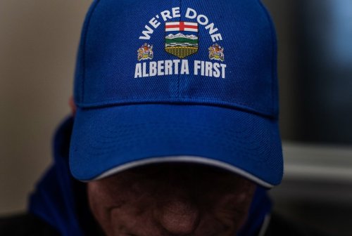 A person wears an Alberta First hat while taking part in signing a petition that seeks to have a referendum on Alberta separation in Stony Plain, Alta., Thursday, Jan. 22, 2026. THE CANADIAN PRESS/Jason Franson
