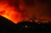 The McDougall Creek wildfire burns on the mountainside above houses in West Kelowna, B.C., on Friday, August 18, 2023. THE CANADIAN PRESS/Darryl Dyck