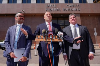 Attorney Bradford Cohen, center, speaks with fellow lawyers Saam Zangeneh, left, and John Helms after a detention hearing in Federal Court for their client rapper Pooh Shiesty, whose legal name is Lontrell Williams Jr., in Dallas, Wednesday, April 8, 2026. (AP Photo/LM Otero)