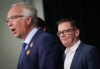 BC United Leader Kevin Falcon, back right, listens as BC Conservative Leader John Rustad speaks during a news conference, in Vancouver, on Wednesday, August 28, 2024. Opposition Leader Kevin Falcon has announced that he is suspending BC United's election campaign and is encouraging supporters to instead back the rival BC Conservative Party. THE CANADIAN PRESS/Darryl Dyck