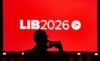 An attendee takes a photo of the main stage at the Liberal Convention in Montreal on Thursday, April 9, 2026. THE CANADIAN PRESS/Christinne Muschi