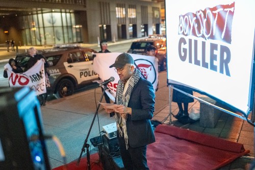 Demonstrators gather in front of a downtown Toronto hotel on Monday afternoon as the Giller Award ceremony was about to begin, chanting 