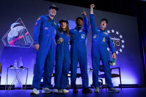 The Artemis II crew (from left) Jeremy Hansen, Christina Koch, Victor Glover and Reid Wiseman come to centre stage at the end of a crew return event on Saturday, April 11, 2026, at Ellington Field in Houston. (AP Photo/Michael Wyke)