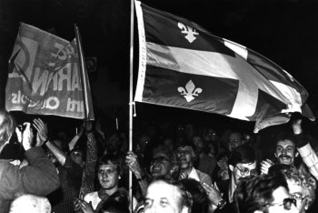 Supporters wave a Quebec flag during a Parti Québécois rally at the Paul Sauvé Arena in Montreal, Oct. 21, 1979. (CP PHOTO/ Doug Ball)