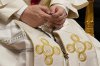 Pope Leo XIV holds a rosary as he leads a vigil for peace inside St. Peter's Basilica at the Vatican, Saturday, April 11, 2026. (AP Photo/Gregorio Borgia)
