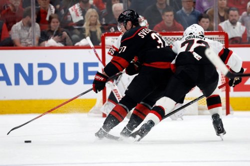 Carolina Hurricanes winger Andrei Svechnikov (37) drives the puck as Ottawa Senators defenceman Thomas Chabot (72) gives chase in Raleigh, N.C., on Saturday, April 18, 2026. (AP Photo/Karl DeBlaker)