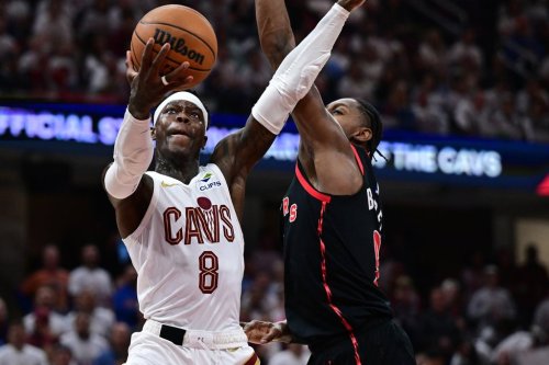 Cleveland Cavaliers guard Dennis Schroder goes to the basket against Toronto Raptors forward RJ Barrett during the second half in Game 5 of a first-round NBA playoffs basketball series, Wednesday, April 29, 2026, In Cleveland. (AP Photo/David Dermer)