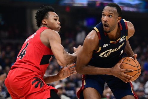 Cleveland Cavaliers centre Evan Mobley goes tot he basket against Toronto Raptors forward Scottie Barnes during the second half in Game 1 of a first-round NBA playoffs basketball series, Saturday, April 18, 2026, In Cleveland. (AP Photo/David Dermer)