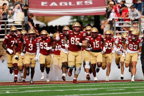 Boston College offensive lineman Logan Taylor (65) leads the team onto the field before an NCAA football game against California on Saturday, Sept. 27, 2025, in Chestnut Hill, Mass. (AP Photo/Greg M. Cooper)