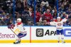 Montréal Canadiens left wing Juraj Slafkovský (20) celebrates his goal with right wing Cole Caufield against the Tampa Bay Lightning during overtime in Game 1 of an NHL hockey Stanley Cup first-round playoff series, Sunday, April 19, 2026, in Tampa, Fla. (AP Photo/Chris O'Meara)