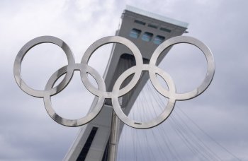 The Olympic rings are displayed outside the tower on the Olympic Stadium in Montreal on Monday, May 4, 2026. THE CANADIAN PRESS/Christinne Muschi
