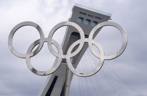 The Olympic rings are displayed outside the tower on the Olympic Stadium in Montreal on Monday, May 4, 2026. THE CANADIAN PRESS/Christinne Muschi