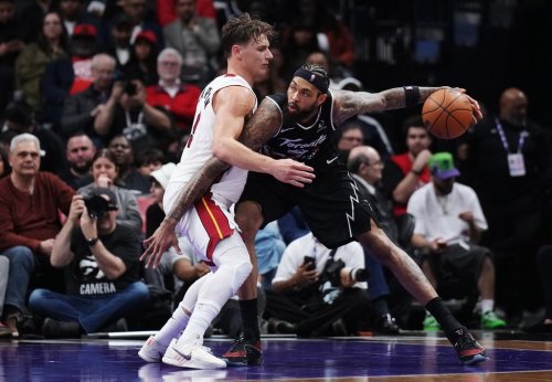 Toronto Raptors' Brandon Ingram (right) protects the ball from Miami Heat's Pelle Larsson (9) during second half NBA basketball action in Toronto on Thursday, April 9, 2026. THE CANADIAN PRESS/Nathan Denette