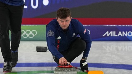 Britain's Bruce Mouat, centre, competes during a men's curling gold medal match between Britain and Canada, at the 2026 Winter Olympics, in Cortina d'Ampezzo, Italy, Saturday, Feb. 21, 2026. (AP Photo/Fatima Shbair)
