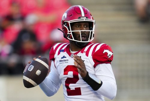 Calgary Stampeders quarterback P.J. Walker (2) looks for a pass while taking on the Ottawa Redblacks during first half CFL football action in Ottawa on Thursday, July 31, 2025. THE CANADIAN PRESS/Sean Kilpatrick