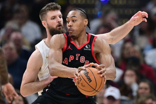 Toronto Raptors forward Scottie Barnes drives on Cleveland Cavaliers forward Dean Wade during the second half in Game 5 of a first-round NBA playoffs basketball series, Wednesday, April 29, 2026, in Cleveland. (AP Photo/David Dermer)
