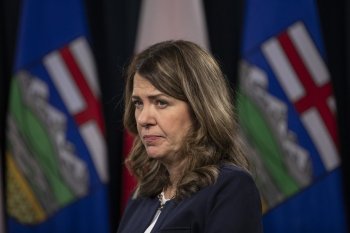 Alberta Premier Danielle Smith speaks to the media at the legislature in Edmonton, on Wednesday, Dec. 10, 2025. THE CANADIAN PRESS/Amber Bracken