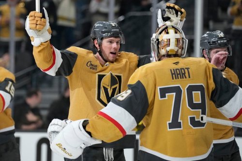 Vegas Golden Knights defenceman Jeremy Lauzon, left, celebrates with Vegas Golden Knights goaltender Carter Hart (79) after defeating the Utah Mammoth in Game 1 of a first-round NHL hockey Stanley Cup playoff series Sunday, April 19, 2026, in Las Vegas. (AP Photo/John Locher)