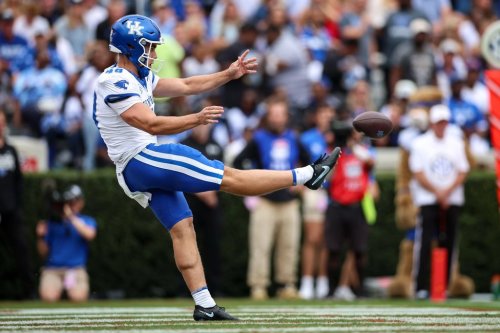 Kentucky kicker Aidan Laros (48) punts the ball during the first half of an NCAA college football game against Georgia, Saturday, Oct. 4, 2025, in Athens, Ga. (AP Photo/Colin Hubbard)