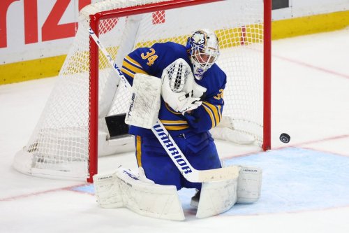 Buffalo Sabres goaltender Alex Lyon (34) makes a save during the third period in Game 5 of a first-round NHL hockey Stanley Cup playoff series against the Boston Bruins Tuesday, April 28, 2026, in Buffalo, N.Y. (AP Photo/Jeffrey T. Barnes)