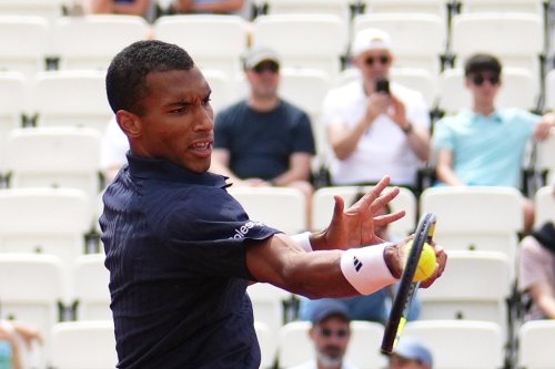 Canada's Felix Auger Aliassime returns the ball to Argentina's Mariano Navone during their match at the Italian Open tennis tournament in Rome, Saturday, May 9, 2026. (AP Photo/Alessandra Tarantino)