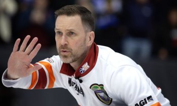 Brad Gushue calls to his teammates during the 3v4 Page Playoffs at the Montana's Brier in St. John's, N.L., on March 7, 2026. THE CANADIAN PRESS/Paul Daly
