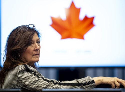 Katherine Henderson, president and chief executive officer of Hockey Canada, looks on before unveiling the roster for Canada's 2026 Olympic hockey team, at a press conference in Minneapolis, Wednesday, Dec. 31, 2025. THE CANADIAN PRESS/Christopher Katsarov