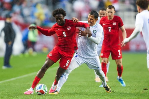 Canada's Ismael Kone (8) and Uzbekistan's Otabek Shukurov (7) vie for the ball during the first half of an international men's soccer friendly in Edmonton on Monday, June 1, 2026. THE CANADIAN PRESS/Codie McLachlan
