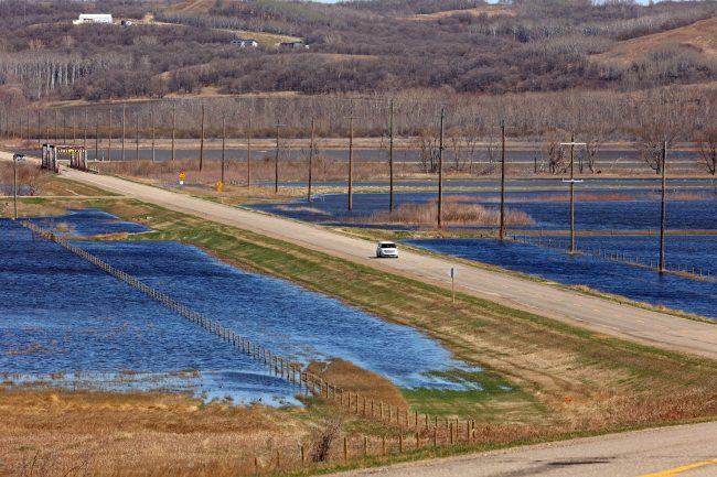 Floodwater from the swollen Assiniboine River covers pasture bordering Highway 250 north of Alexander on Tuesday. (Tim Smith/The Brandon Sun)