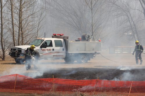 01052026
Firefighters battle a grass fire on Friday afternoon south of Brandon. The fire started just east of Highway 10 and south of grid road 54 N. It spread eastward south of 54 N and south along 109 W threatening homes in the area. Firefighters and volunteers battled the blaze throughout the afternoon, as it picked up over and over again. Brandon Fire and emergency Services was joined by members of the Oakland Wawanesa Fire Department.
(Tim Smith/The Brandon Sun)
