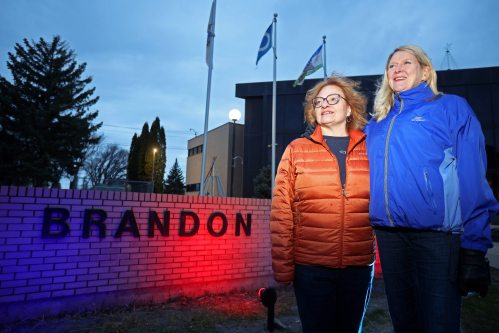04052026
Renee McKinnon of Brandon and Julie Vogelsang of Winnipeg outside Brandon City Hall on Monday evening. McKinnon and Vogelsang both live with fibromuscular dysplasia and Vogelsang is a volunteer with the FMD Society. For the first time, Brandon City Hall’s sign and flagpole area are lit up in red and blue from May 4-11 in recognition of Fibromuscular Dysplasia (FMD) Awareness Month. Other landmarks across Manitoba are also being lit up this month for FMD awareness. 
 (Tim Smith/The Brandon Sun)