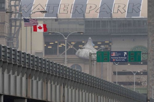 An American flag and Canadian flag are seen on the Rainbow Bridge US-Canada border crossing, Friday, March 20, 2026, in Niagara Falls, N.Y. (AP Photo/Yuki Iwamura)