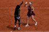 Canada's Gabriela Dabrowski and Evan King of the United States react during the mixed doubles final tennis match against Italy's Sara Errani and Andrea Vavassori at the French Open in Paris, Thursday, June 4, 2026. (AP Photo/Emma Da Silva)