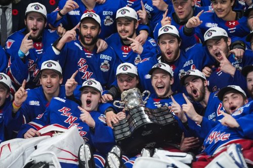 Kitchener Rangers players pose for a team photo after defeating the Everett Silvertips to win the Memorial Cup final hockey game, in Kelowna, B.C., on Sunday, May 31, 2026. THE CANADIAN PRESS/Darryl Dyck