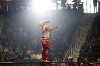 A rodeo entertainer balance a crutch on his chin. (Tim Smith/The Brandon Sun)