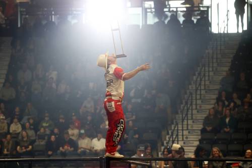A rodeo entertainer balance a crutch on his chin. (Tim Smith/The Brandon Sun)
