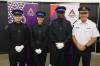 Assiniboine College public safety program graduates Mason Vinthers (from left), Michelle Omand and Osahon Ebose are joined by Brandon Police Service Chief Tyler Bates after the graduation ceremony at the college&rsquo;s Victoria East Campus on Friday morning. (Abiola Odutola/The Brandon Sun)