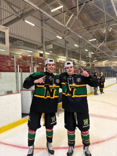 Quinn Schutte, left, poses with fellow Manitoban teammate Chase Cochrane after capturing the Superior International Junior Hockey League title thanks to a 5-4 Game 7 overtime victory against the Fort Frances Lakers last week. (Submitted)