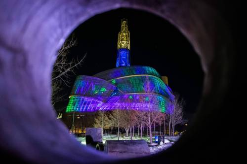 The Canadian Museum for Human Rights, lit with a multicoloured light show, inspired by the northern lights. (Daniel Crump/Winnipeg Free Press files)