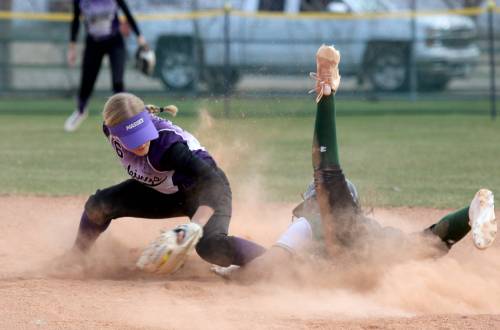 Vincent Massey&rsquo;s Kendra Grift tries to tag Neelin base runner Zara Pople at second during Brandon High School Softball League action at Ashley Neufeld Softball Complex on Tuesday. (Thomas Friesen/The Brandon Sun)