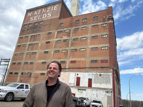 Paul Souque, president of Blackbird Housing Inc., stands in front of the McKenzie Seeds building in downtown Brandon. Blackbird Housing purchased the historic building with plans to develop about 130 residential suites, medical and wellness-related commercial spaces and amenities such as a rooftop deck. (Abiola Odutola/The Brandon Sun)
