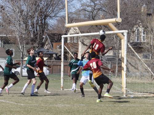 Vincent Enisenyin (19) of the Crocus Plainsmen leaps for a header early into Brandon High School Soccer League action against the Neelin Spartans at Neelin on Wednesday afternoon. (Massimo De Luca-Taronno/The Brandon Sun)