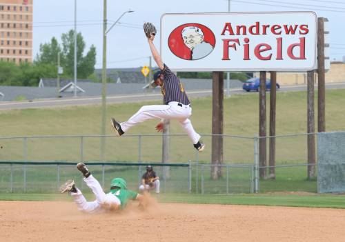 Wawanesa Brewers shortstop Riley Rutherford (11) jumps into the air to try to track down a high throw as Jordan Penner (14) of the Brandon Young Guns slides safely into second for a stolen base during South West Baseball League action at Andrews Field on Saturday evening. The Young Guns won 9-2. (Perry Bergson/The Brandon Sun)
                                May 30, 2026